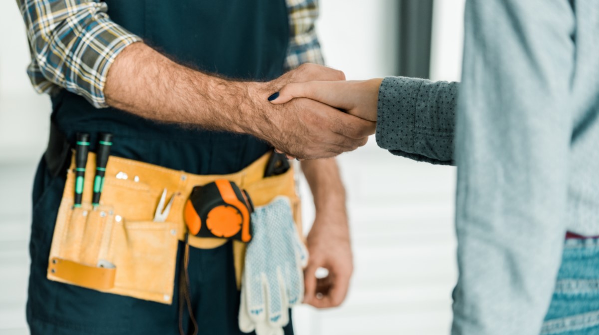 Delivery man greeting the customer